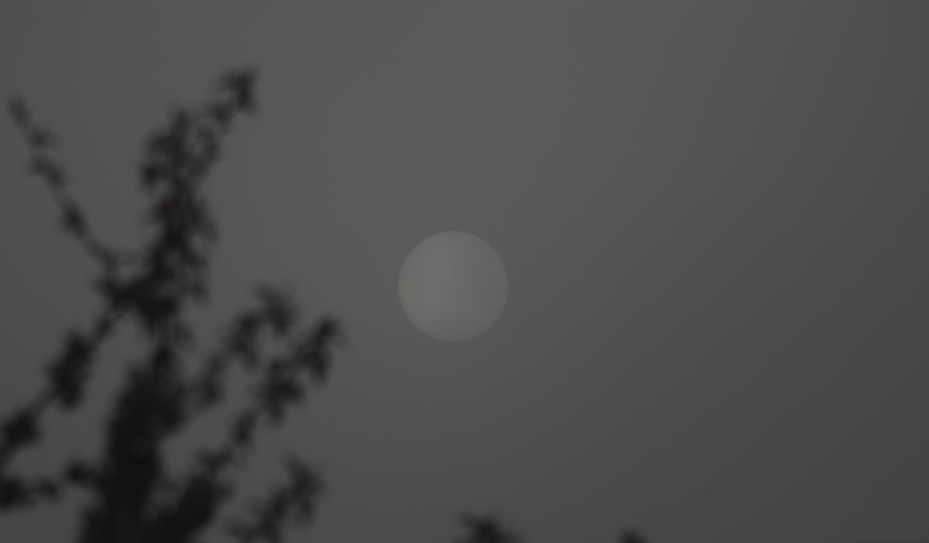 Sun seen through a thick fog with long lens use